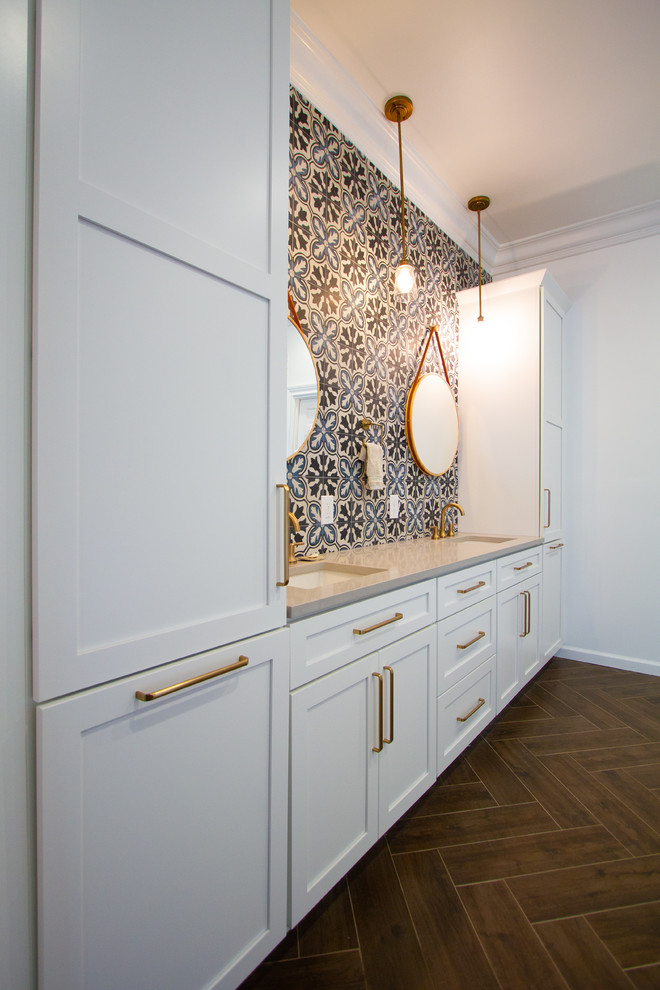 Example of a huge eclectic master multicolored tile and cement tile porcelain tile and brown floor double shower design in Philadelphia with recessed-panel cabinets, white cabinets, a two-piece toilet, white walls, an undermount sink, quartzite countertops, a hinged shower door and beige countertops