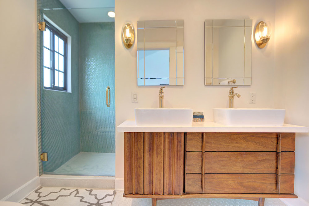 Double shower - mid-sized mid-century modern master multicolored tile and ceramic tile ceramic tile double shower idea in Los Angeles with a vessel sink, furniture-like cabinets, medium tone wood cabinets, quartz countertops, a one-piece toilet and white walls
