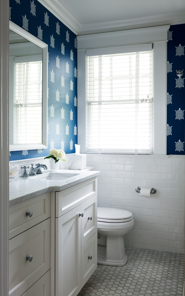 На фото: детская ванная комната в стиле неоклассика (современная классика) с белыми фасадами, накладной ванной, душем над ванной, белой плиткой, плиткой кабанчик, синими стенами, мраморным полом, врезной раковиной, мраморной столешницей, белым полом, шторкой для ванной и белой столешницей
