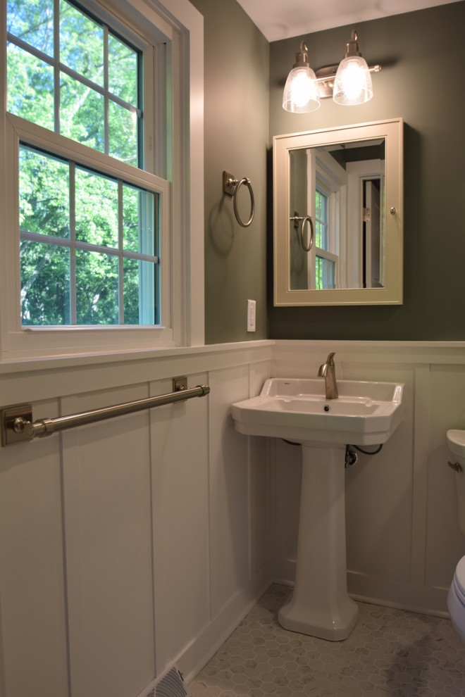 This is an example of a small classic shower room bathroom in Other with an alcove shower, a one-piece toilet, white tiles, metro tiles, green walls, ceramic flooring, a pedestal sink, white floors, a hinged door, a shower bench, a single sink and wainscoting.