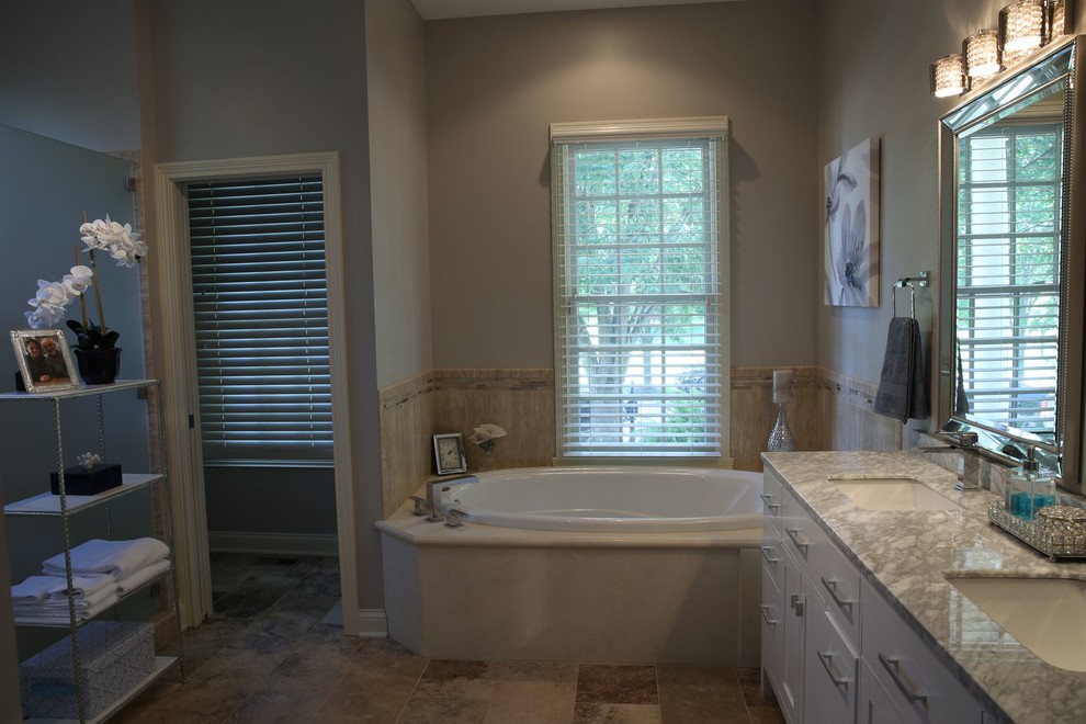 Mid-sized minimalist master ceramic tile marble floor and beige floor bathroom photo in Indianapolis with shaker cabinets, a two-piece toilet, gray walls, an integrated sink and marble countertops