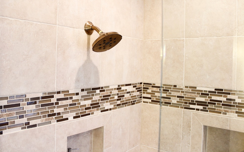 Example of a large classic master brown tile and porcelain tile porcelain tile bathroom design in Atlanta with a vessel sink, raised-panel cabinets, brown cabinets, granite countertops, a two-piece toilet and brown walls