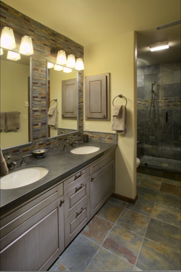 Design ideas for a large contemporary ensuite bathroom in Denver with raised-panel cabinets, grey cabinets, an alcove shower, brown tiles, grey tiles, slate tiles, beige walls, slate flooring, a submerged sink, concrete worktops, grey floors and a hinged door.
