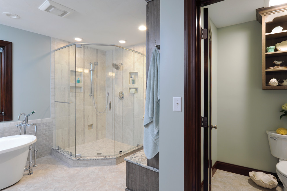 Photo of a large contemporary ensuite bathroom in Cincinnati with a submerged sink, recessed-panel cabinets, grey cabinets, engineered stone worktops, a freestanding bath, a corner shower, a two-piece toilet, white tiles, porcelain tiles, blue walls and vinyl flooring.