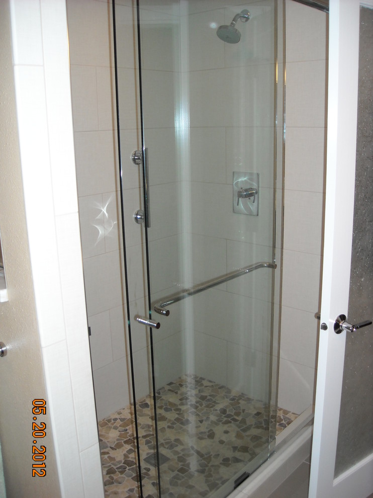 Small 1950s master brown tile and glass sheet porcelain tile alcove shower photo in Portland with flat-panel cabinets, dark wood cabinets, a two-piece toilet, an undermount sink and quartz countertops