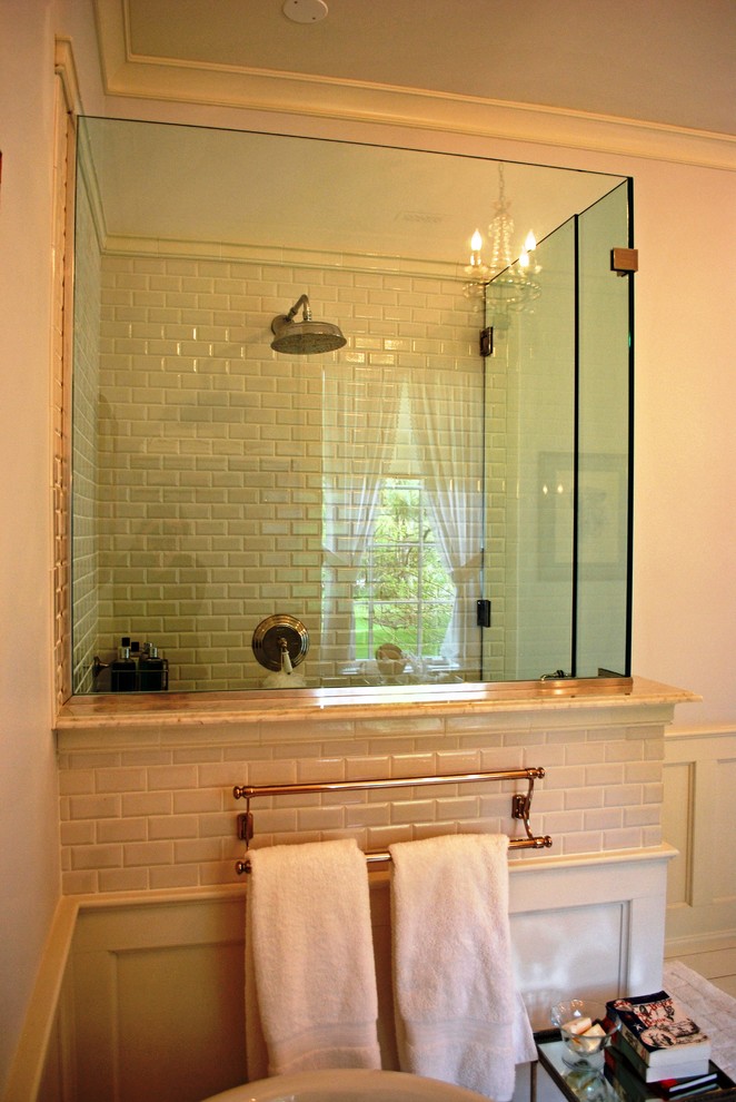 Example of a classic white tile and ceramic tile doorless shower design in New York with white walls