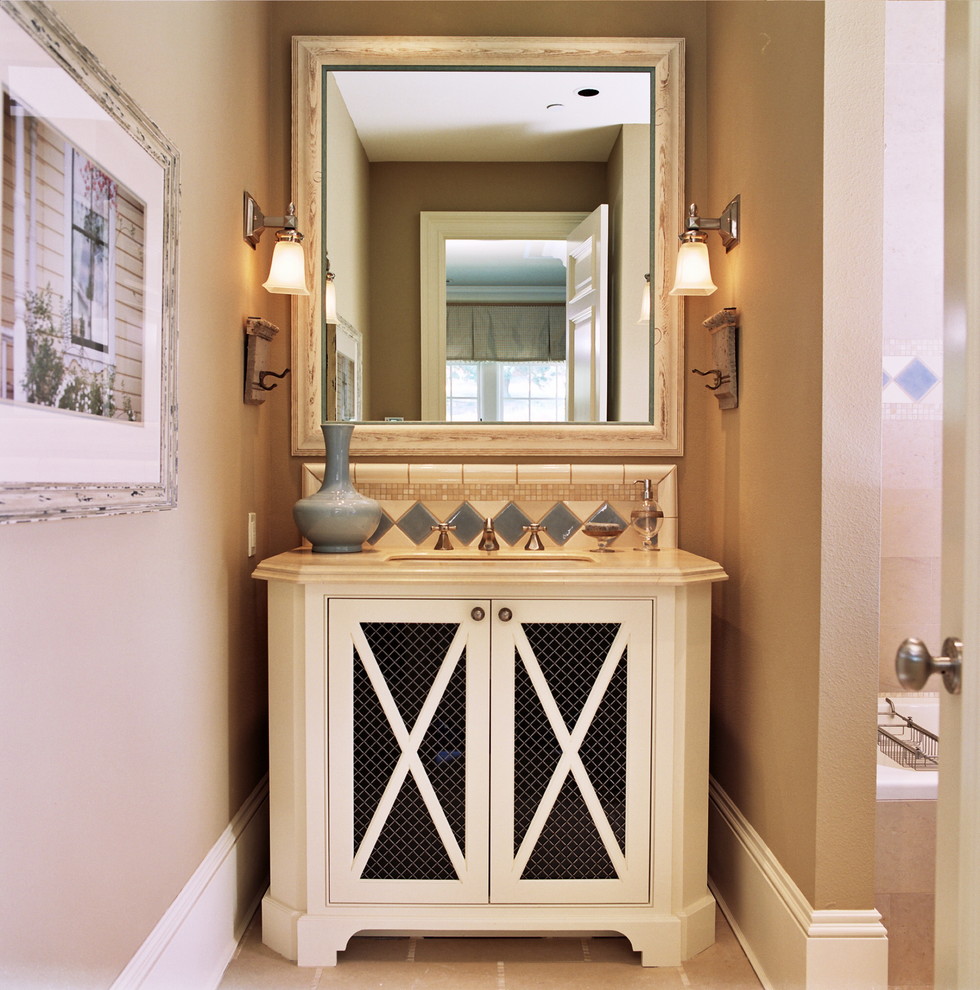 Design ideas for a traditional bathroom in Portland with recessed-panel cabinets.