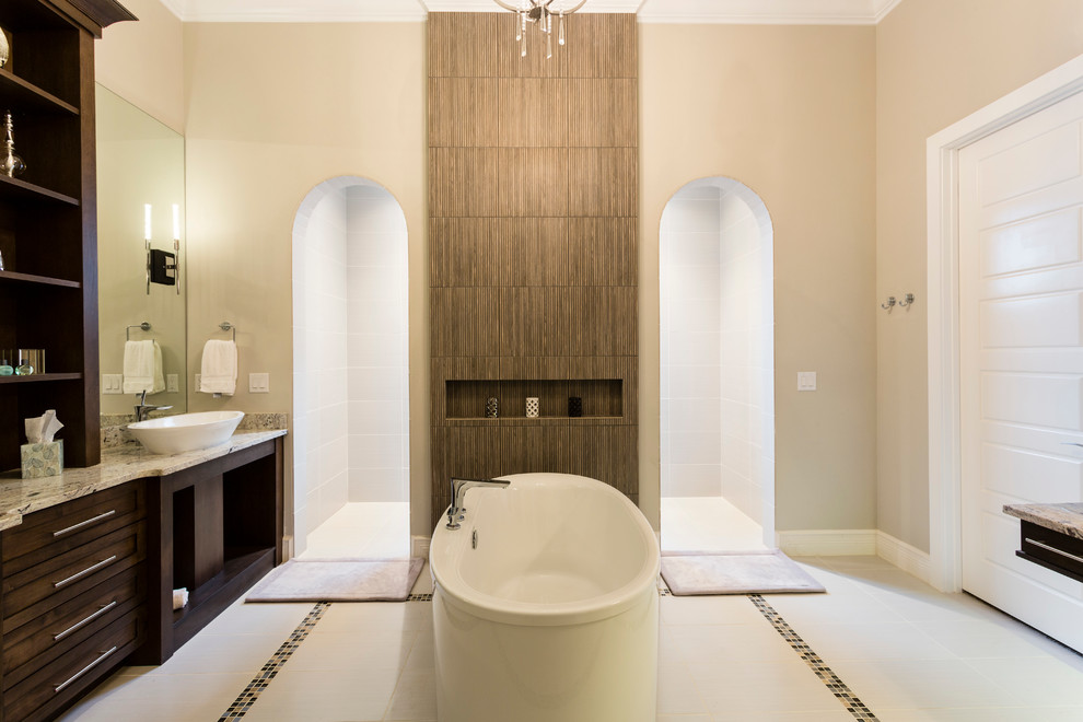 Inspiration pour une grande salle de bain principale design en bois foncé avec un placard à porte shaker, un carrelage beige, un mur beige, une vasque, une baignoire indépendante, une douche à l'italienne et aucune cabine.