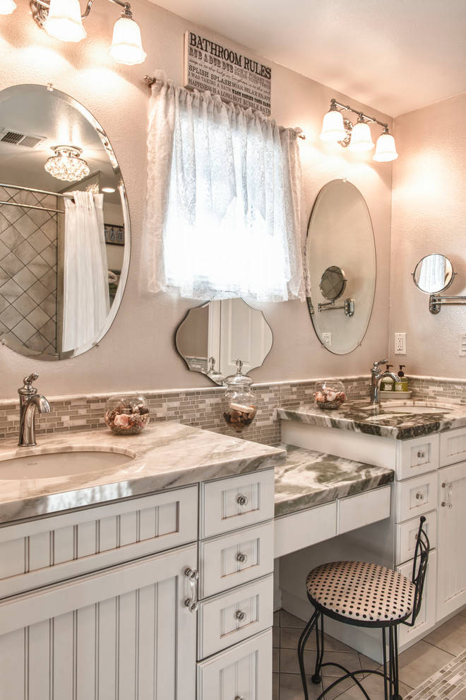 Bathroom - traditional bathroom idea in Los Angeles with an undermount sink, white cabinets and gray walls