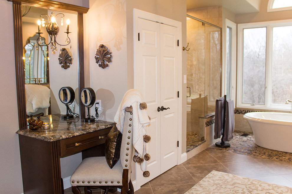 Photo of a medium sized classic ensuite bathroom in St Louis with brown cabinets, a freestanding bath, a walk-in shower, beige walls, beige floors and a hinged door.