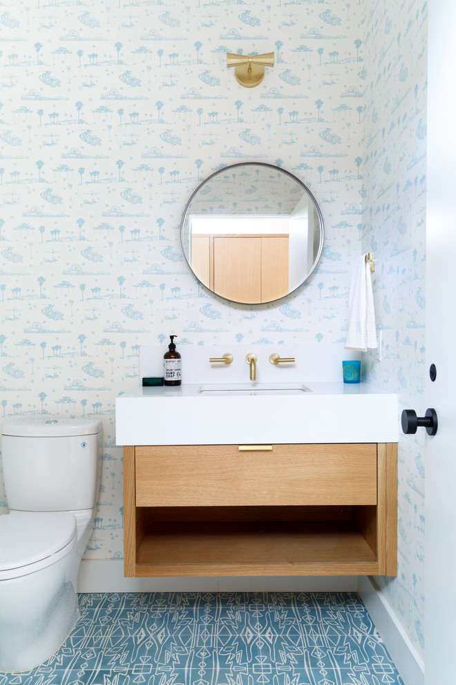 Photo of a small midcentury shower room bathroom in Los Angeles with flat-panel cabinets, light wood cabinets, a freestanding bath, an alcove shower, a one-piece toilet, grey tiles, ceramic tiles, white walls, cement flooring, a submerged sink, engineered stone worktops and multi-coloured floors.