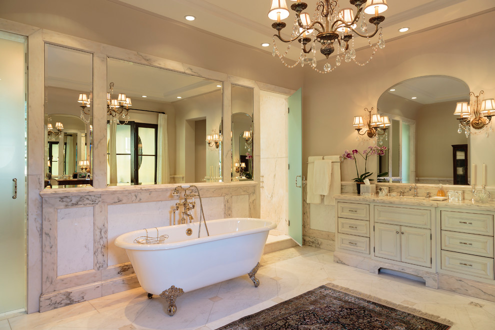 Bathroom - huge mediterranean master white tile and stone slab marble floor bathroom idea in Los Angeles with an undermount sink, recessed-panel cabinets, white cabinets, marble countertops and gray walls