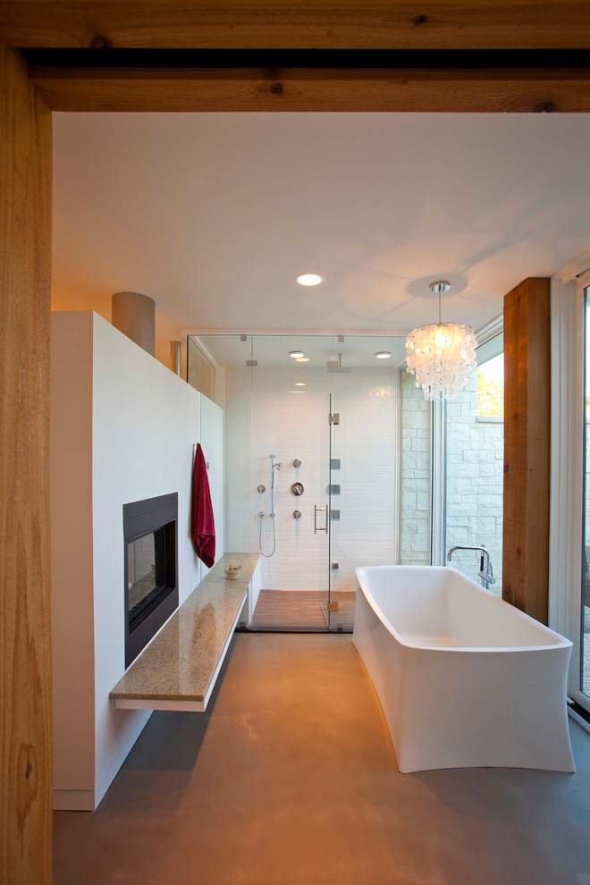 This is an example of a modern bathroom in Cincinnati with a freestanding bath.