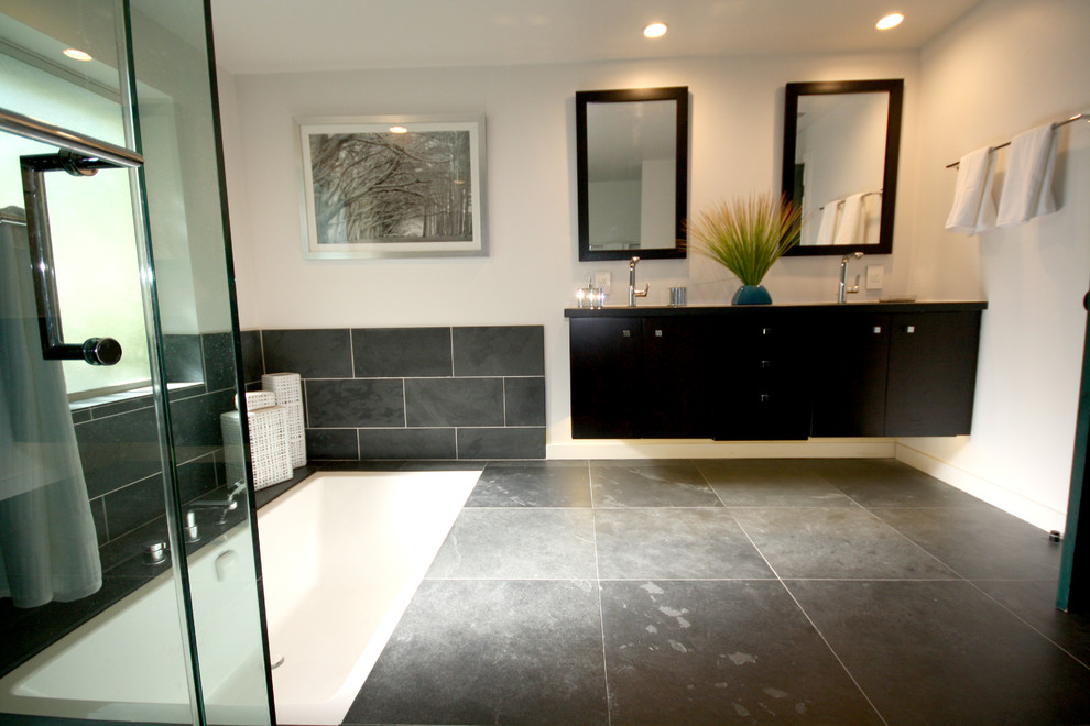 This is an example of a medium sized modern ensuite bathroom in Los Angeles with flat-panel cabinets, dark wood cabinets, soapstone worktops, grey tiles and ceramic tiles.