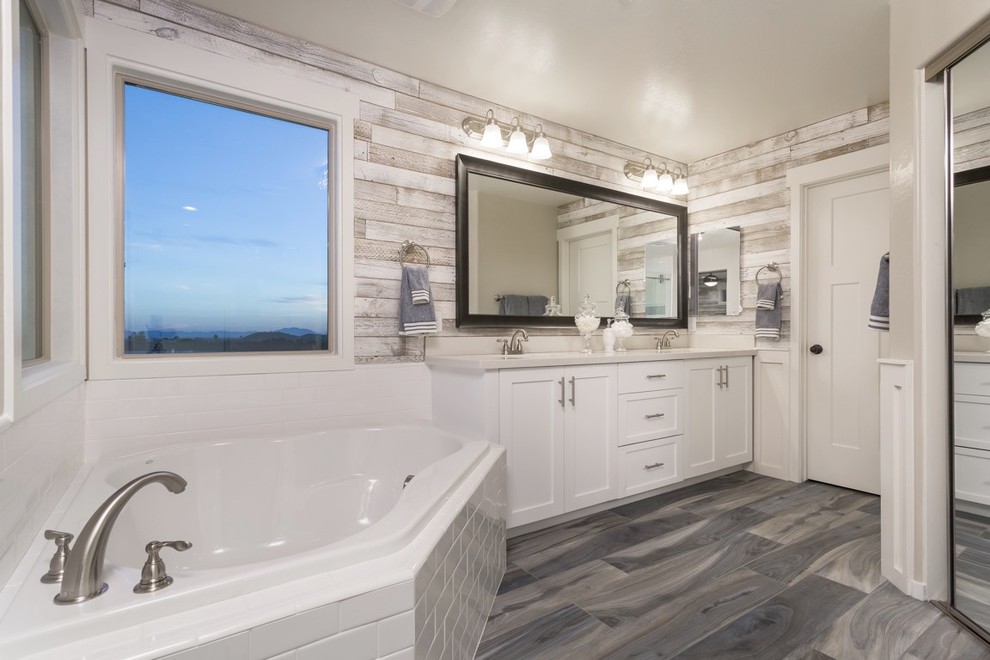 Inspiration for a large contemporary ensuite bathroom in Phoenix with white cabinets, grey tiles, porcelain tiles, white walls, a submerged sink, quartz worktops, porcelain flooring, brown floors, shaker cabinets and a built-in bath.