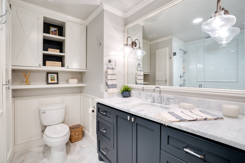 This is an example of a small traditional ensuite bathroom in Oklahoma City with shaker cabinets, black cabinets, an alcove shower, white tiles, cement tiles, grey walls, marble flooring, a submerged sink, marble worktops, grey floors, a hinged door and white worktops.