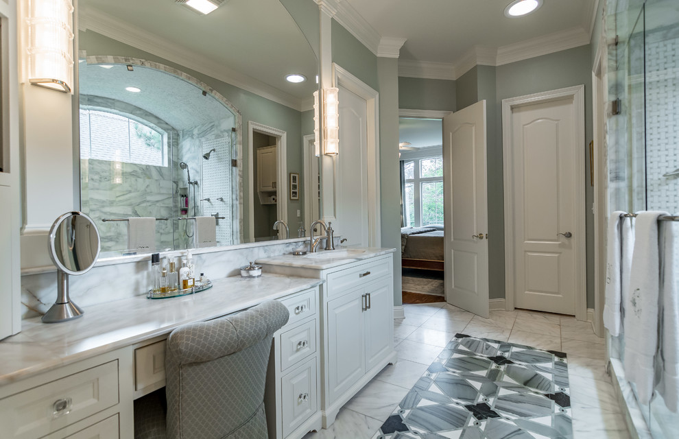 Mid-sized elegant master white tile marble floor double shower photo in New Orleans with raised-panel cabinets, white cabinets, marble countertops, blue walls and an undermount sink