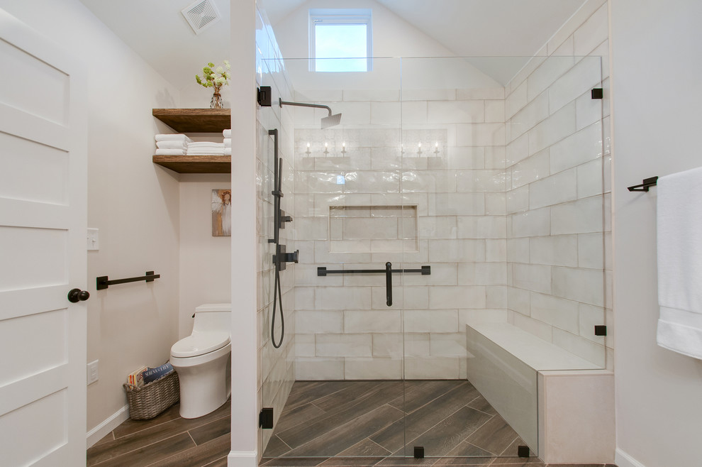 Inspiration for a medium sized mediterranean ensuite bathroom in Nashville with shaker cabinets, white cabinets, a built-in shower, a one-piece toilet, white tiles, ceramic tiles, white walls, ceramic flooring, a submerged sink, granite worktops, brown floors, a hinged door and grey worktops.