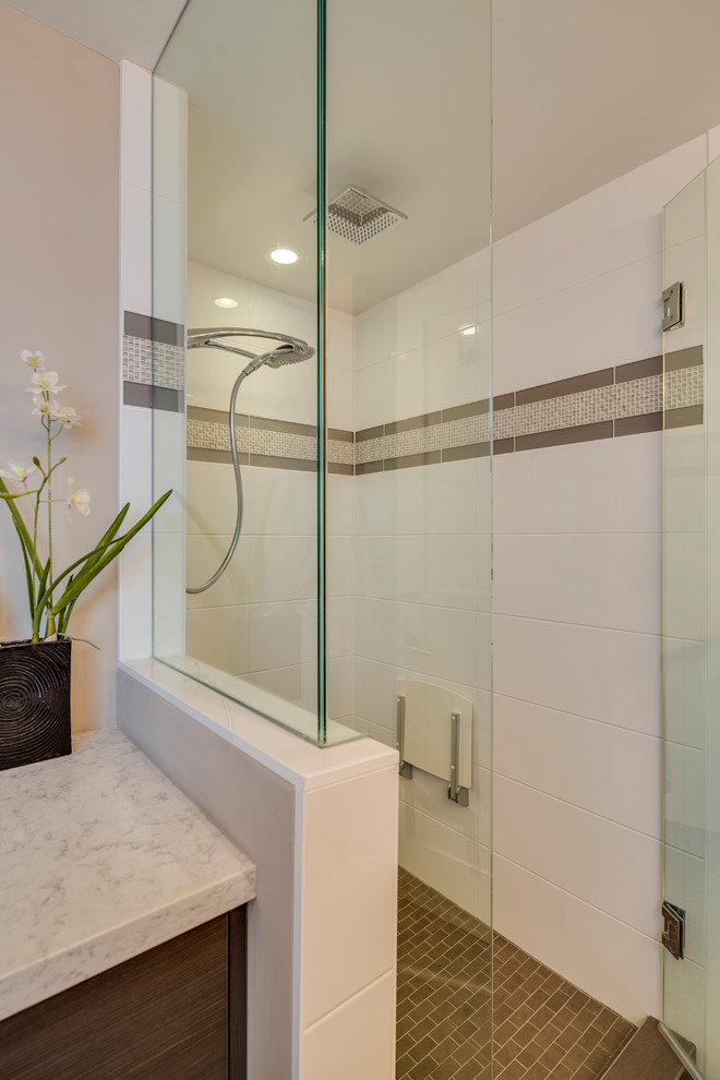 Photo of a medium sized contemporary ensuite bathroom in Vancouver with flat-panel cabinets, dark wood cabinets, a built-in bath, an alcove shower, a two-piece toilet, white tiles, ceramic tiles, beige walls, ceramic flooring, a submerged sink and engineered stone worktops.