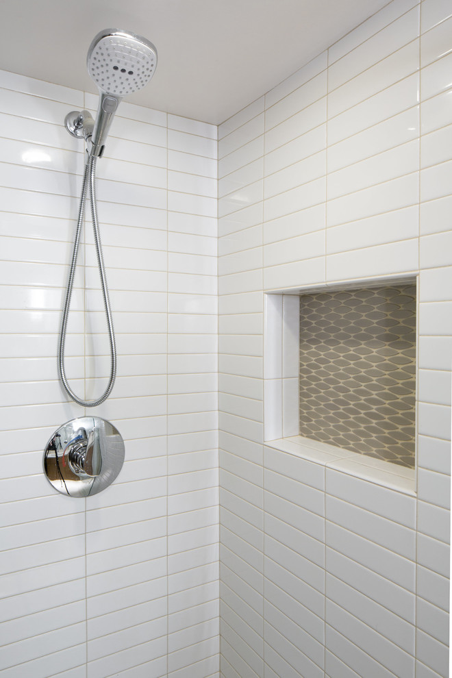 Inspiration for a mid-sized contemporary 3/4 white tile and porcelain tile porcelain tile corner shower remodel in Seattle with flat-panel cabinets, light wood cabinets, a one-piece toilet, white walls, an undermount sink and quartz countertops