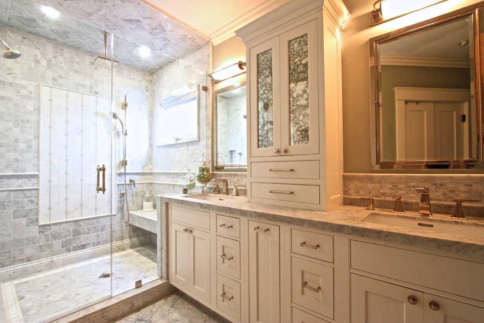 Inspiration for a huge transitional master beige tile marble floor alcove shower remodel in Orange County with shaker cabinets, beige cabinets, a two-piece toilet, green walls, an undermount sink and marble countertops