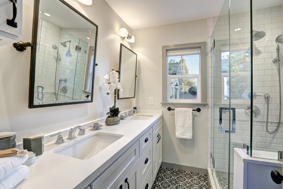 Design ideas for a medium sized classic shower room bathroom in Los Angeles with shaker cabinets, white cabinets, an alcove shower, white tiles, metro tiles, white walls, mosaic tile flooring, a submerged sink, multi-coloured floors, a hinged door, white worktops, double sinks and a built in vanity unit.