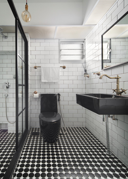 Black and White Bathroom with Brass Accents 