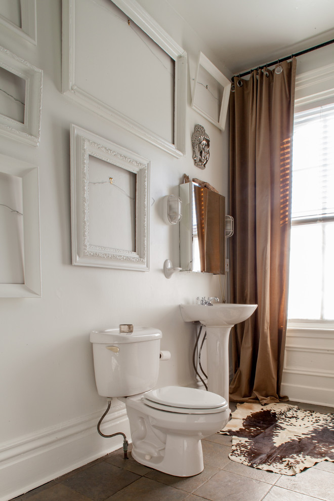 Inspiration for an eclectic brown tile bathroom remodel in Other with a pedestal sink and a two-piece toilet