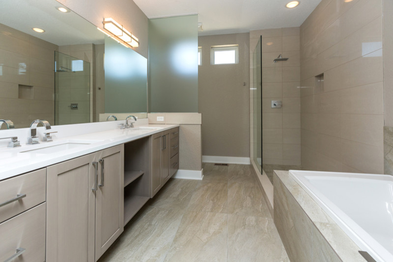 Example of a mid-sized transitional master gray tile and porcelain tile vinyl floor doorless shower design in Other with an undermount sink, flat-panel cabinets, dark wood cabinets, quartz countertops, a two-piece toilet and gray walls