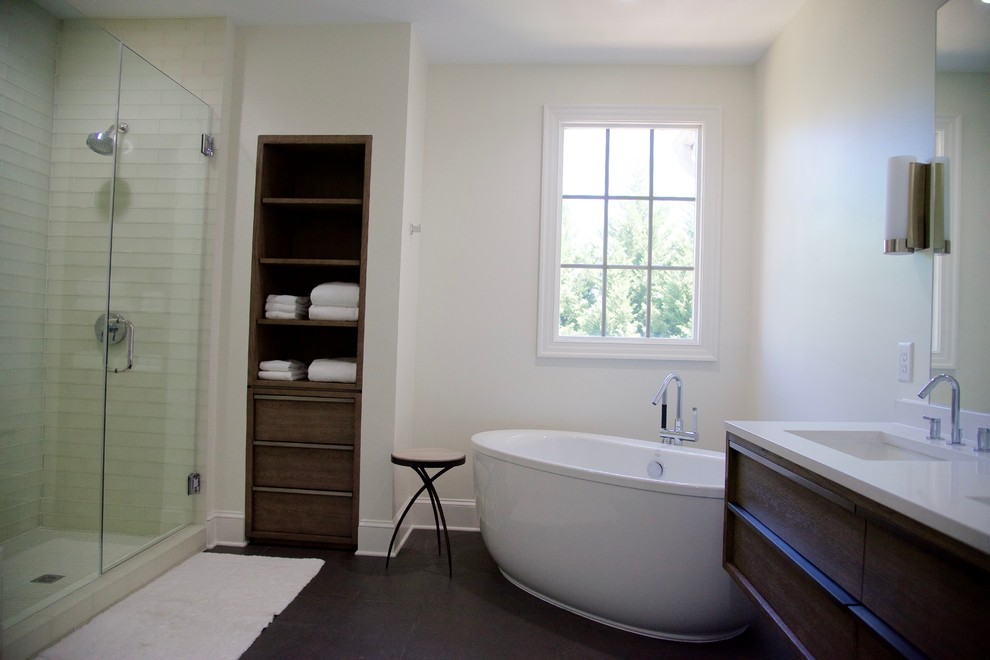 Bathroom - mid-sized contemporary master white tile and glass tile ceramic tile bathroom idea in Raleigh with furniture-like cabinets, dark wood cabinets, a two-piece toilet, white walls, an undermount sink and quartz countertops