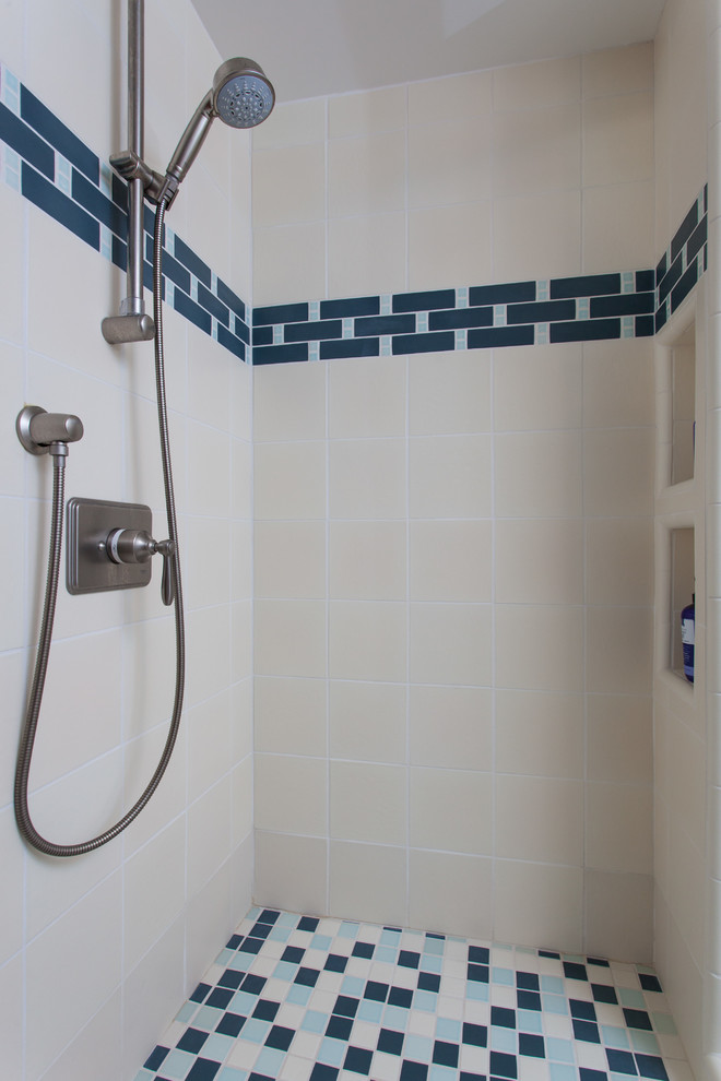 Inspiration for a small craftsman kids' blue tile and porcelain tile porcelain tile and white floor corner shower remodel in San Francisco with shaker cabinets, white cabinets, an undermount tub, a one-piece toilet, blue walls, a pedestal sink, quartzite countertops, a hinged shower door and white countertops