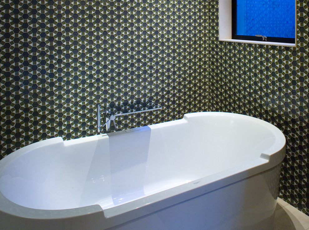 Example of a trendy freestanding bathtub design in San Francisco with gray walls