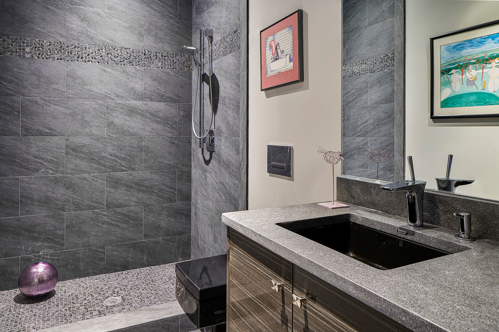 Example of a trendy gray tile and porcelain tile double shower design in Charleston with a wall-mount toilet, beige walls, an undermount sink and granite countertops