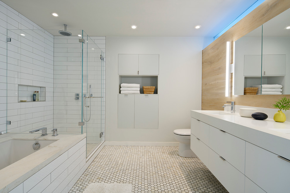 Midcentury bathroom in San Francisco with flat-panel cabinets, white cabinets, a submerged bath, a corner shower, a one-piece toilet, white tiles, metro tiles, white walls, a submerged sink and engineered stone worktops.