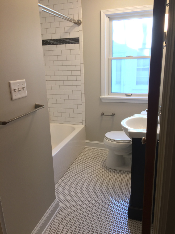 Design ideas for a small classic family bathroom in Minneapolis with an alcove bath, an alcove shower, a two-piece toilet, white tiles, metro tiles, green walls, mosaic tile flooring, a console sink, white floors, a shower curtain, white worktops, a single sink and a freestanding vanity unit.