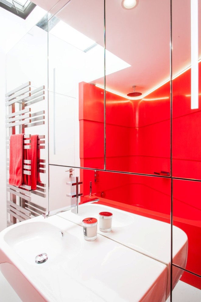 Contemporary bathroom in Buckinghamshire with solid surface worktops, red tiles, a built-in bath and red walls.