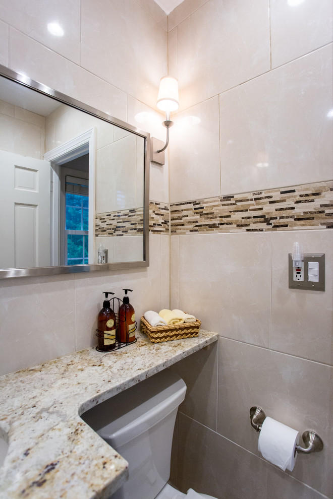 Example of a mid-sized trendy kids' beige tile and porcelain tile porcelain tile bathroom design in DC Metro with a vessel sink, flat-panel cabinets, dark wood cabinets, laminate countertops, a bidet and black walls