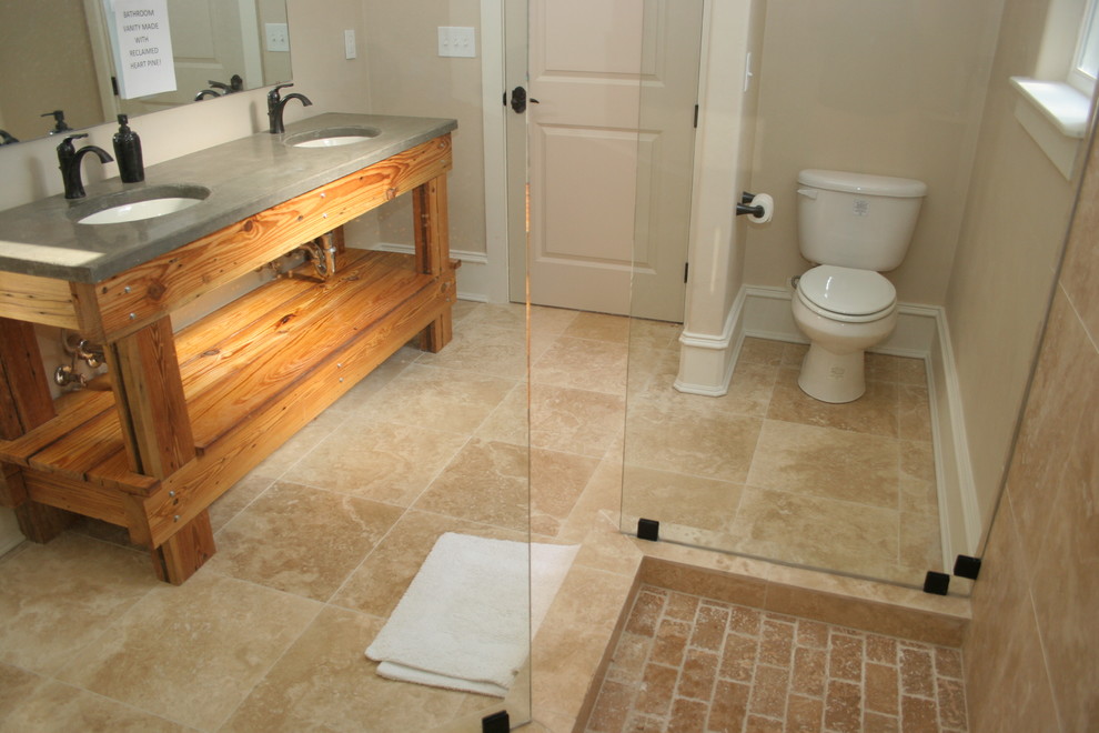 Example of a small farmhouse 3/4 beige tile corner shower design in Atlanta with an undermount sink, open cabinets, concrete countertops, a one-piece toilet and beige walls