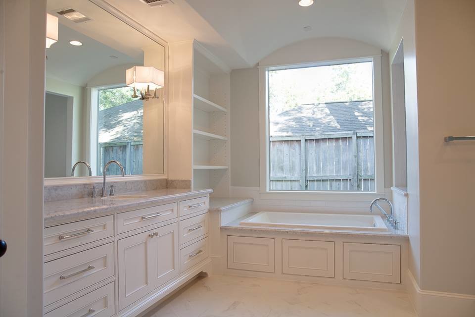 This is an example of a medium sized traditional ensuite bathroom in Phoenix with recessed-panel cabinets, white cabinets, a built-in bath, a shower/bath combination, a two-piece toilet, grey walls, porcelain flooring, a submerged sink, white floors and an open shower.