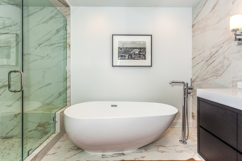 Inspiration for a large modern master white tile porcelain tile and white floor bathroom remodel in Los Angeles with flat-panel cabinets, dark wood cabinets, gray walls, an integrated sink, quartz countertops, a hinged shower door and white countertops