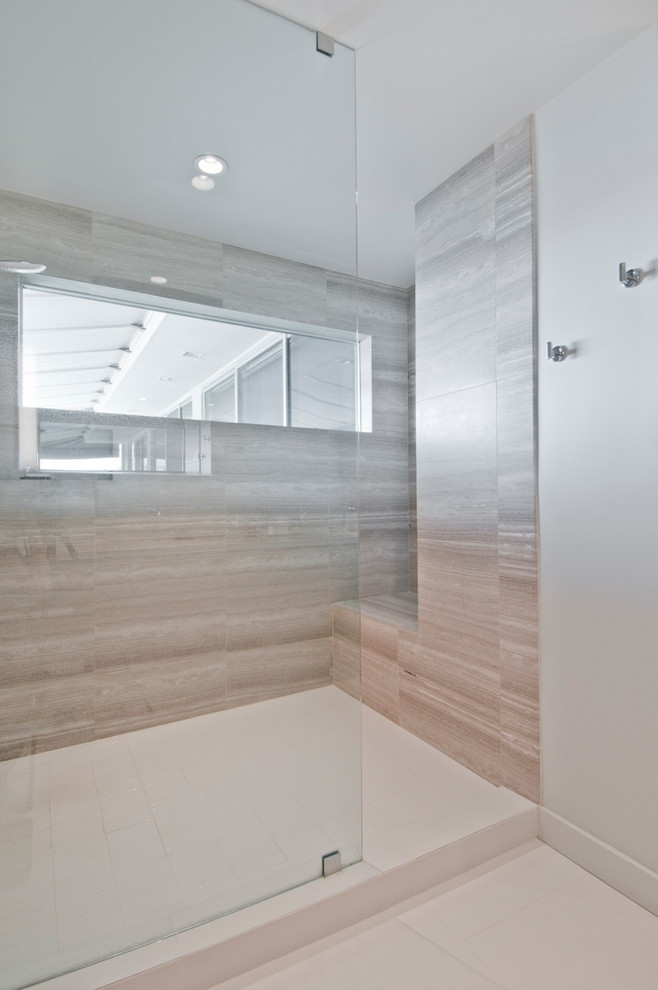 Design ideas for a large modern ensuite bathroom in Los Angeles with flat-panel cabinets, brown cabinets, a walk-in shower, grey tiles, limestone tiles, white walls, porcelain flooring, a submerged sink, beige floors and an open shower.