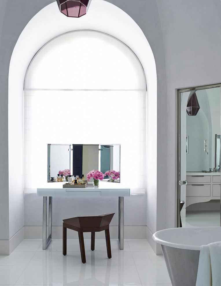 Classic ensuite bathroom in Los Angeles with a freestanding bath, white walls and porcelain flooring.