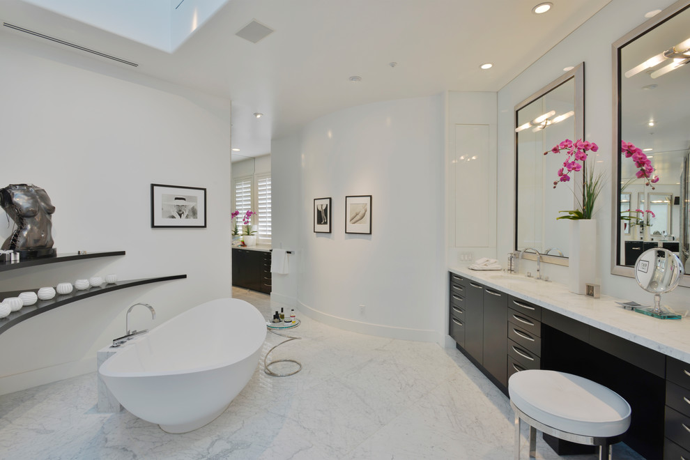 Inspiration for a contemporary white tile freestanding bathtub remodel in Los Angeles with flat-panel cabinets, dark wood cabinets and white walls