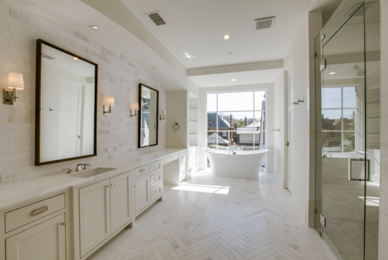 Large transitional master white tile limestone floor bathroom photo in Dallas with marble countertops, recessed-panel cabinets, white cabinets and white walls