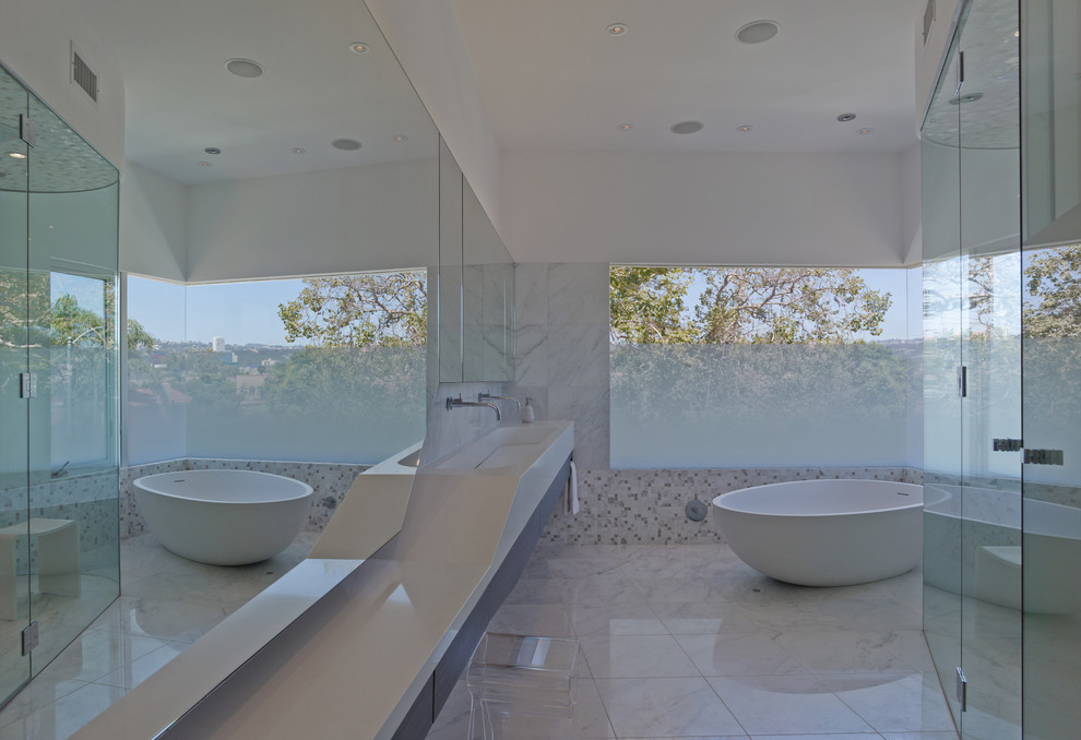 Medium sized contemporary ensuite bathroom in Los Angeles with a trough sink, flat-panel cabinets, dark wood cabinets, quartz worktops, a freestanding bath, a built-in shower, a one-piece toilet, white tiles, stone tiles, white walls and marble flooring.