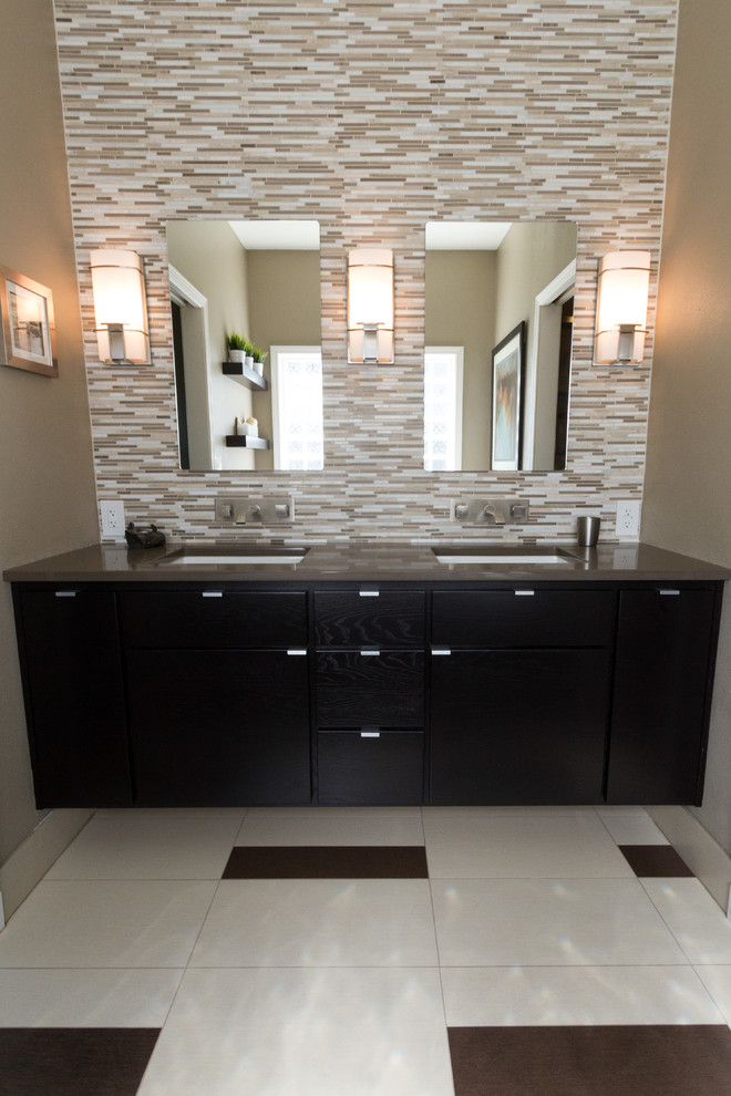 Large contemporary ensuite bathroom in Portland with a submerged sink, flat-panel cabinets, black cabinets, solid surface worktops, multi-coloured tiles, ceramic tiles, beige walls and marble flooring.