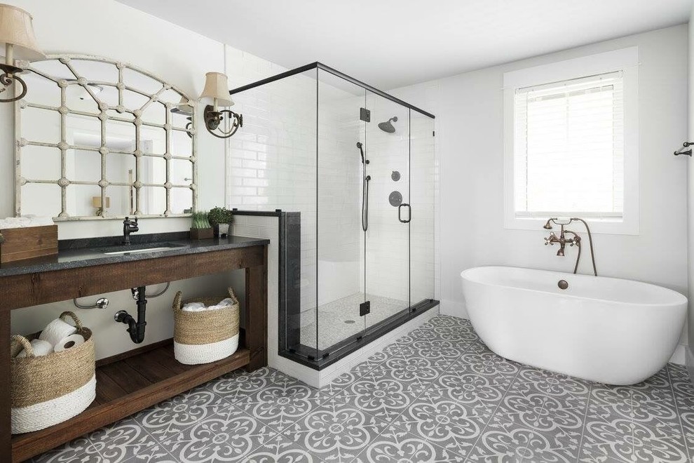 Inspiration for a mid-sized transitional 3/4 white tile and subway tile cement tile floor and gray floor bathroom remodel in Birmingham with open cabinets, dark wood cabinets, white walls, an undermount sink, a hinged shower door and gray countertops