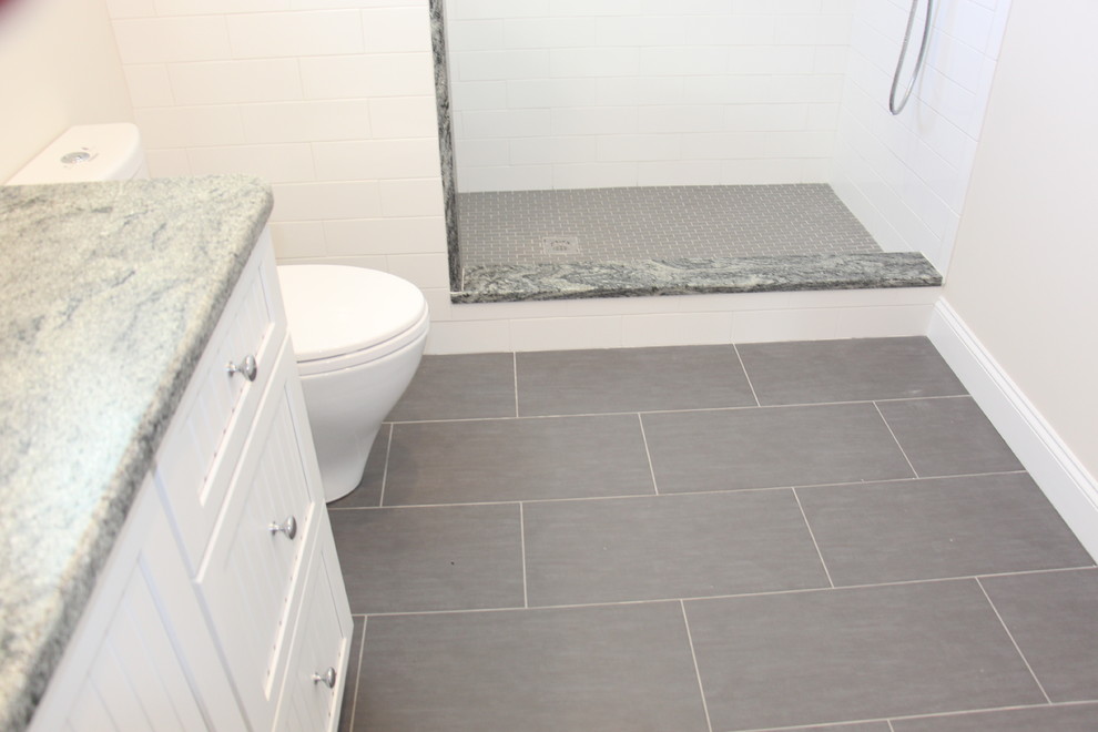 Medium sized family bathroom in Boston with an alcove shower, a two-piece toilet, white tiles, ceramic tiles and porcelain flooring.
