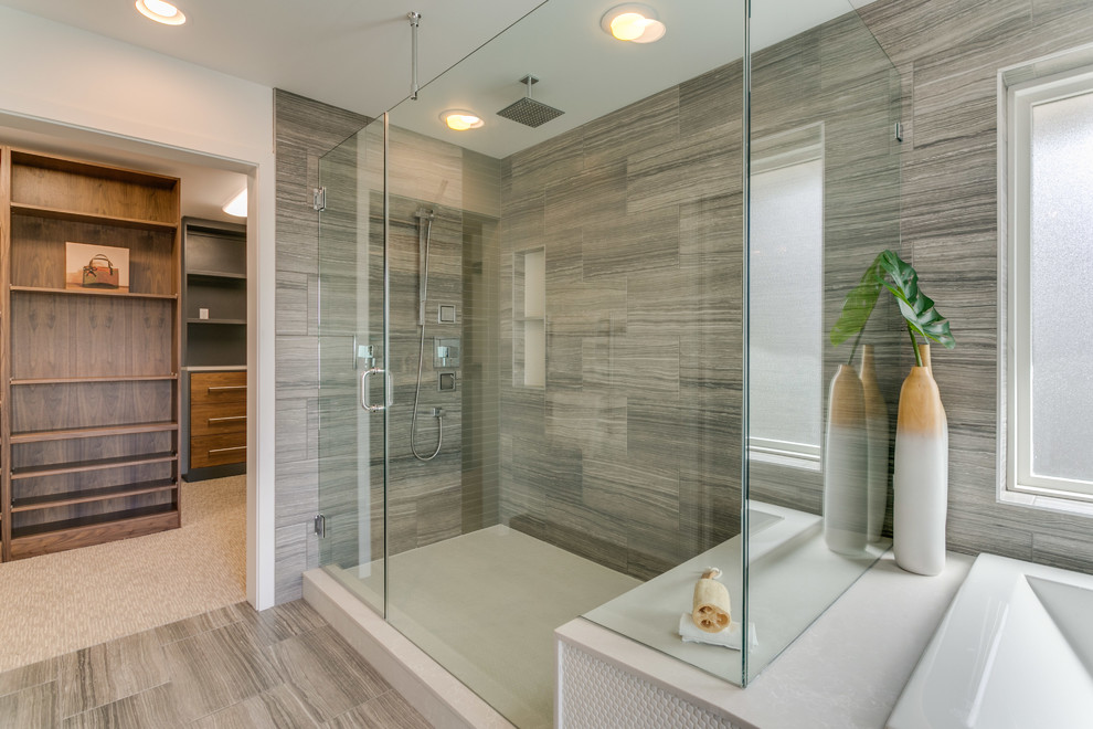 Alcove shower - large contemporary master gray tile and ceramic tile ceramic tile and gray floor alcove shower idea in Seattle with flat-panel cabinets, brown cabinets, an undermount tub, a one-piece toilet, gray walls, an undermount sink, solid surface countertops and a hinged shower door