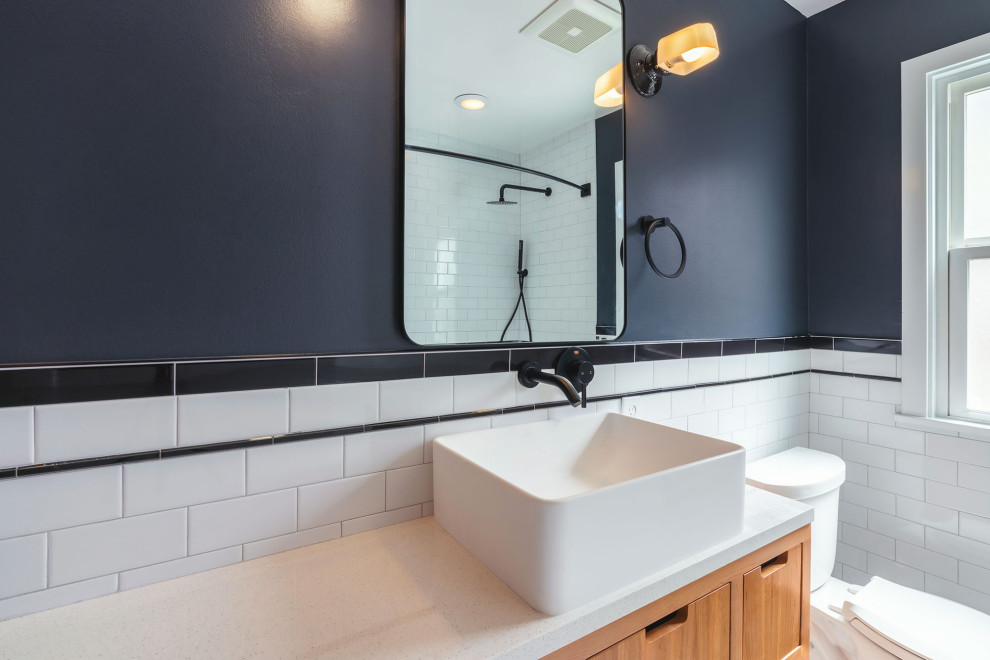 Inspiration for a small mid-century modern 3/4 ceramic tile, black floor and single-sink alcove bathtub remodel in Seattle with beaded inset cabinets, light wood cabinets, black walls, quartzite countertops, white countertops and a freestanding vanity